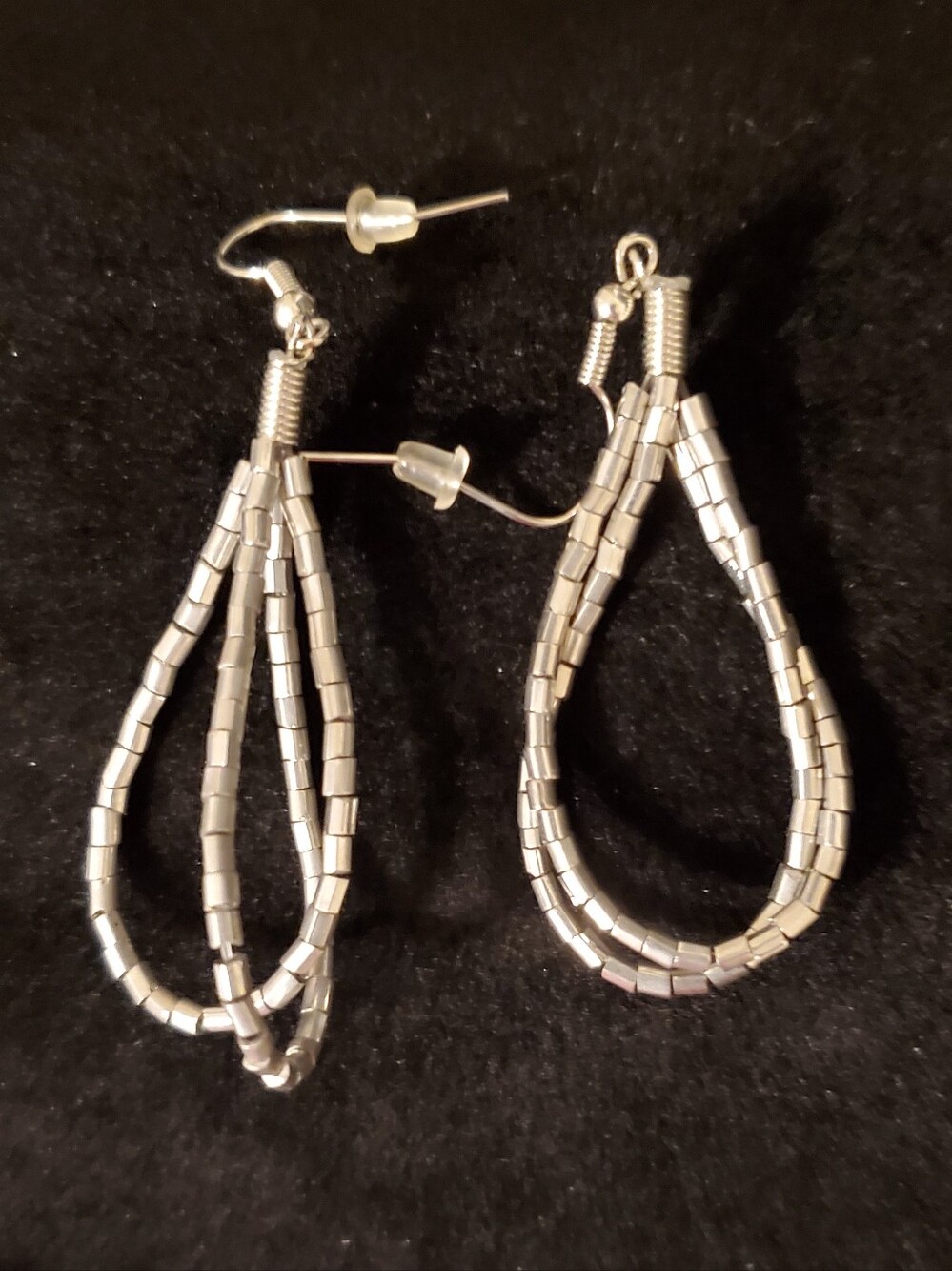 A BRAND NEW PAIR OF TWISTED SOFT SILVER EARRINGS